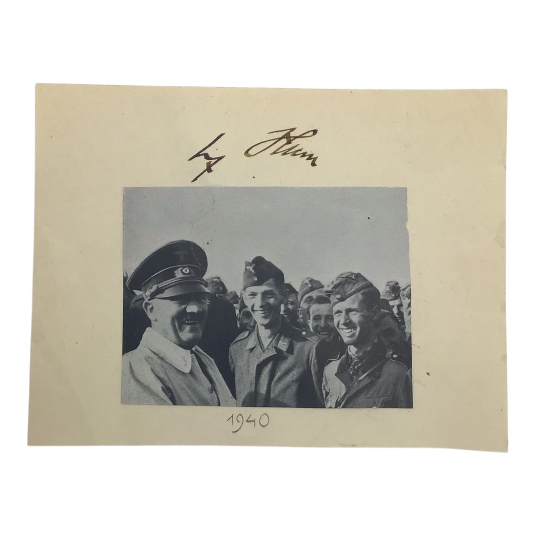 Adolf Hitler Cut Signature, Dated 1940 | Rare German Third Reich Signature & Image: This piece features a cut image of AH along with a signature from Adolf Hitler presented beneath the corresponding period photograph, forming a complete and visually striking display piece. The s
