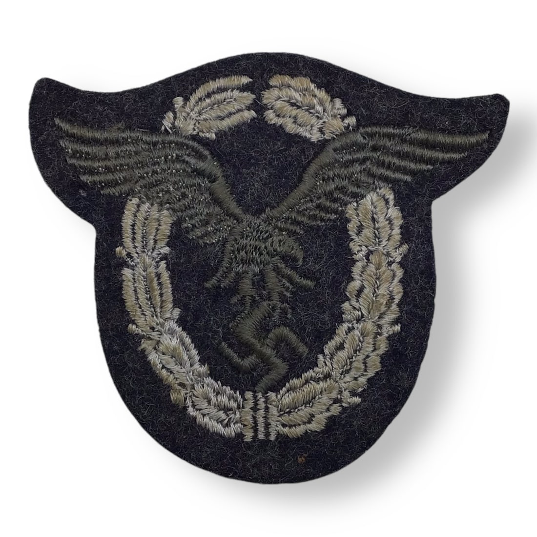 Rare Early War German WW2 Luftwaffe Cloth Pilot Badge - Rare Grey Eagle Version: This scarce German WWII Luftwaffe enlisted or NCO cloth pilot's badge is an early war example of the Flugzeugfuhrerabzeichen Stoffausfuhrung, produced prior to 1942. The badge features the sought-afte