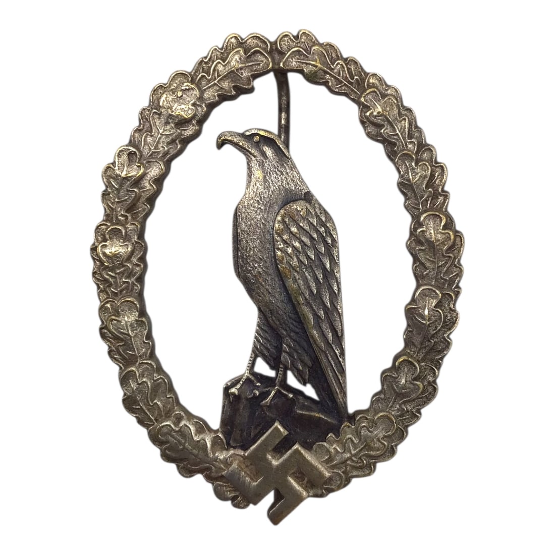 Luftwaffe Retired Pilot Commemorative Badge by C.E. Juncker - German WW2: This extremely rare German WWII Luftwaffe Retired Pilot Commemorative Badge (Flieger-Erinnerungsabzeichen) is a solid-back example manufactured by C.E. Juncker of Berlin. The badge is die-struck from