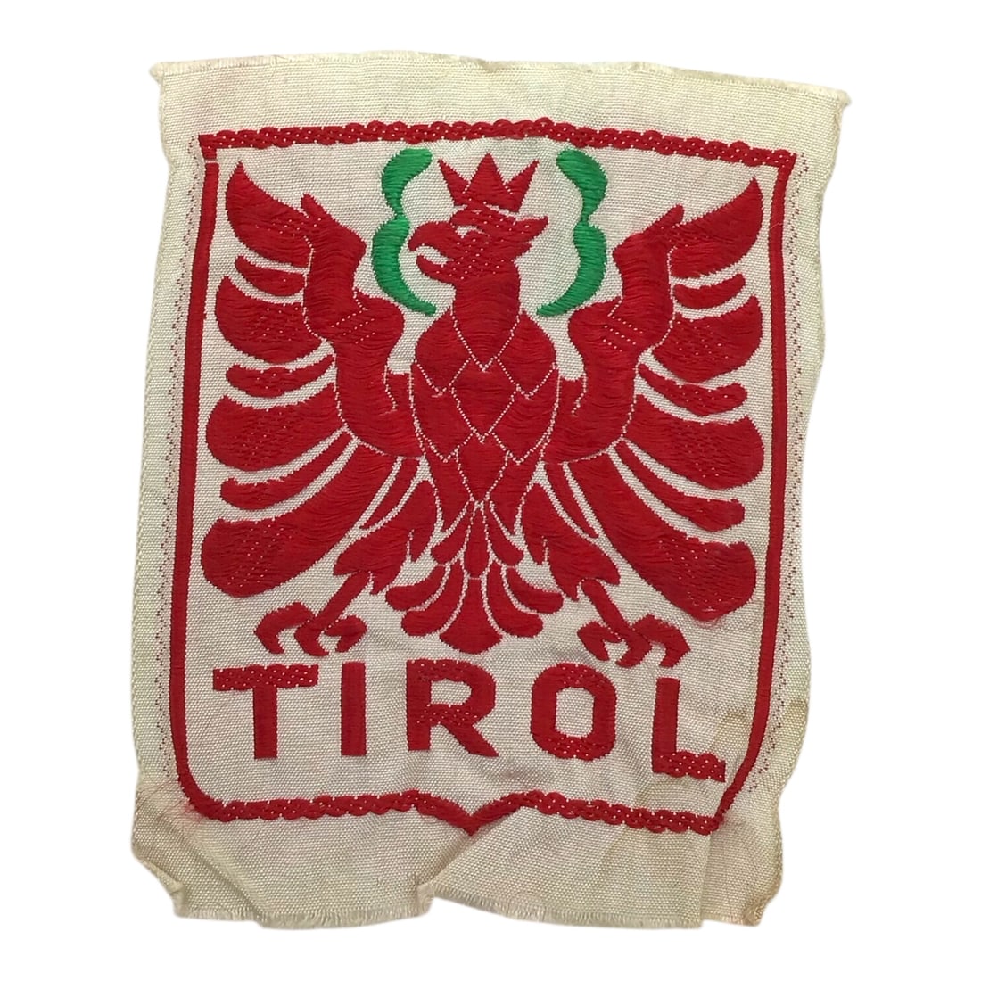 German WW2 Tirol Cloth Arm Patch - Austrian Occupation Insignia: This original German WWII Tirol cloth arm patch represents the western Austrian state of Tirol and features the distinctive Tirol crest. These patches were worn by German occupational personnel and tr
