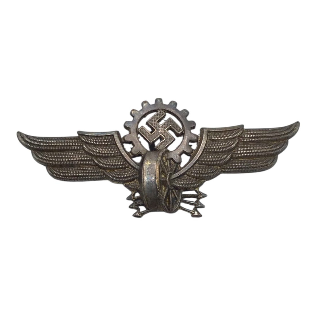 German WW2 Reichsbahn Streetcar & Private Railway Cap Insignia: This original German WWII Reichsbahn streetcar and private railway cap insignia was worn by streetcar and non-state railway personnel during the Third Reich era. The badge features a winged wheel moti