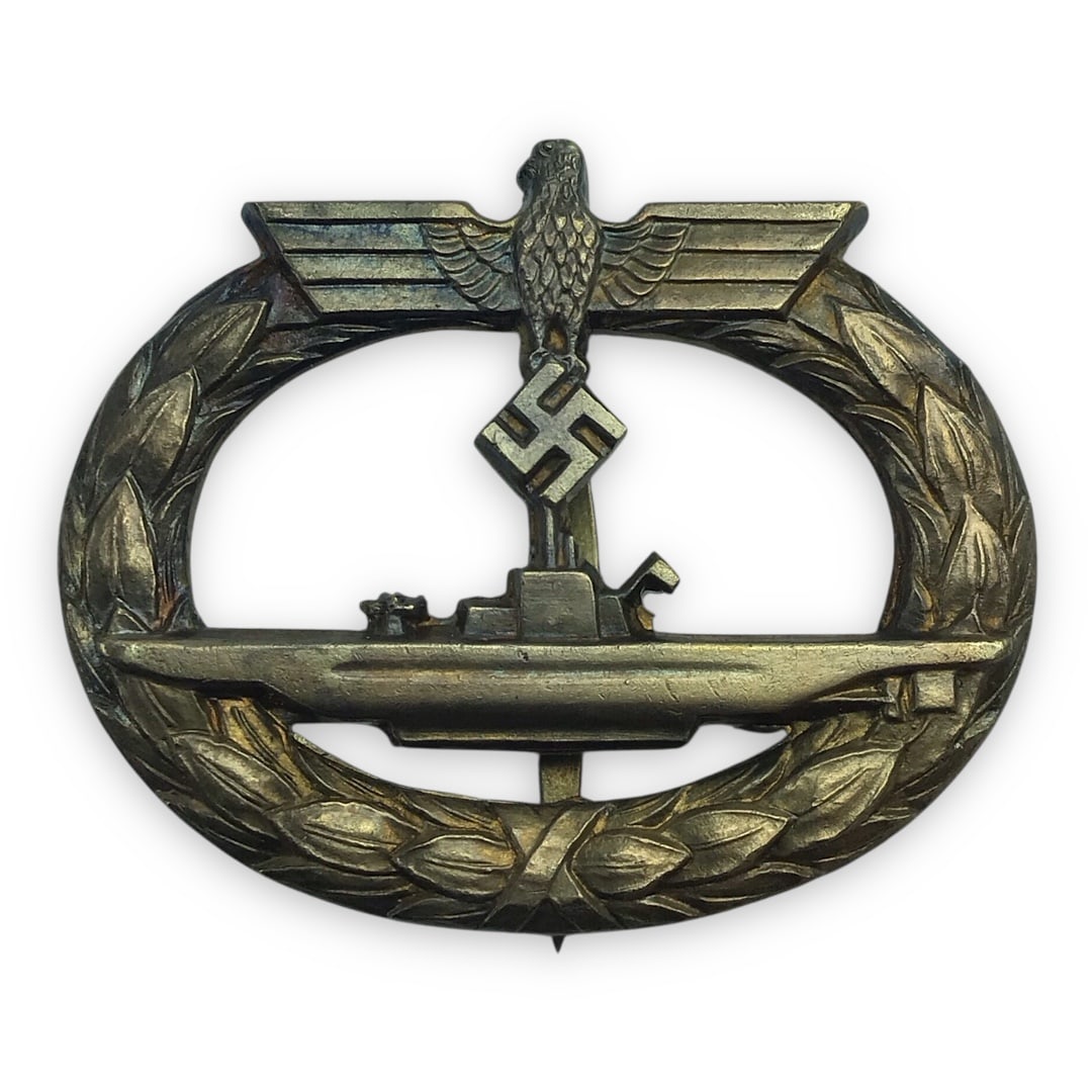 German Kriegsmarine U-Boat War Badge by G.E. Juncker - Marked: This is an original WWII-era German Kriegsmarine U-Boat War Badge (U-Boots-Kriegsabzeichen), awarded to U-Boat crews after two operational patrols or for those wounded in action. This badge is a desir