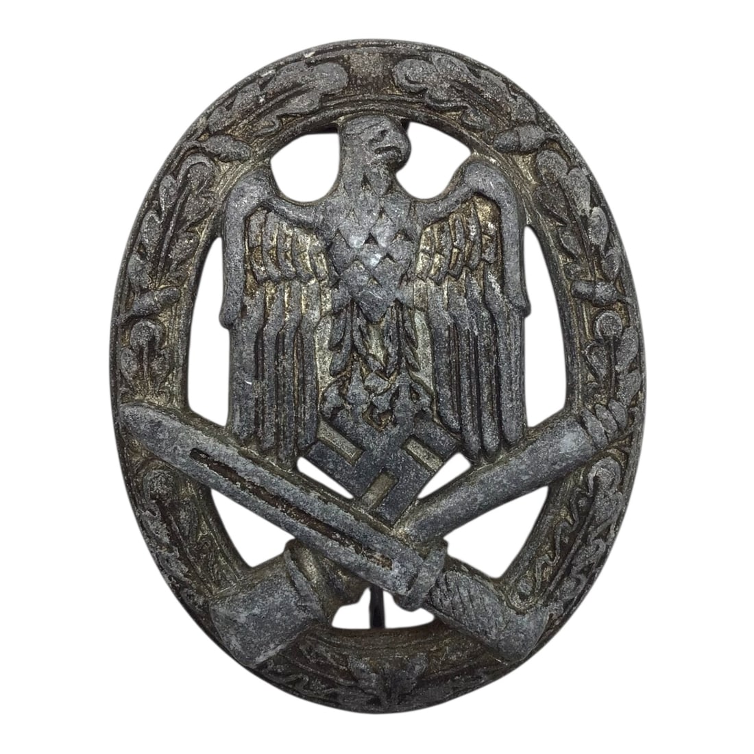 German WW2 Heer General Assault Badge Late War Variant: This original German WWII Heer General Assault Badge is a late-war example retaining its original design and construction. The badge exhibits a "salty" appearance consistent with combat use and age. T