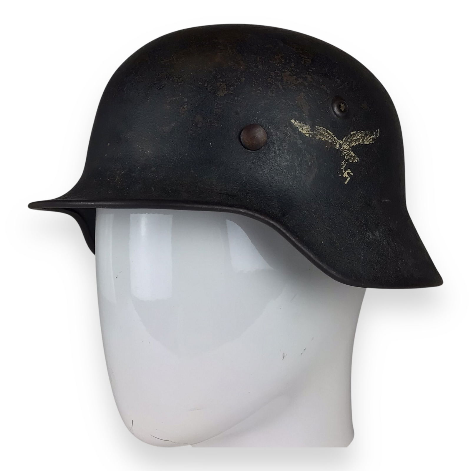 German Luftwaffe M40 Steel Helmet with Strong Eagle Decal and Museum Provenance: This authentic German World War II Luftwaffe M40 steel helmet is a highly desirable combat-used example retaining approximately 70% of its original Luftwaffe eagle decal. The helmet is fitted with its