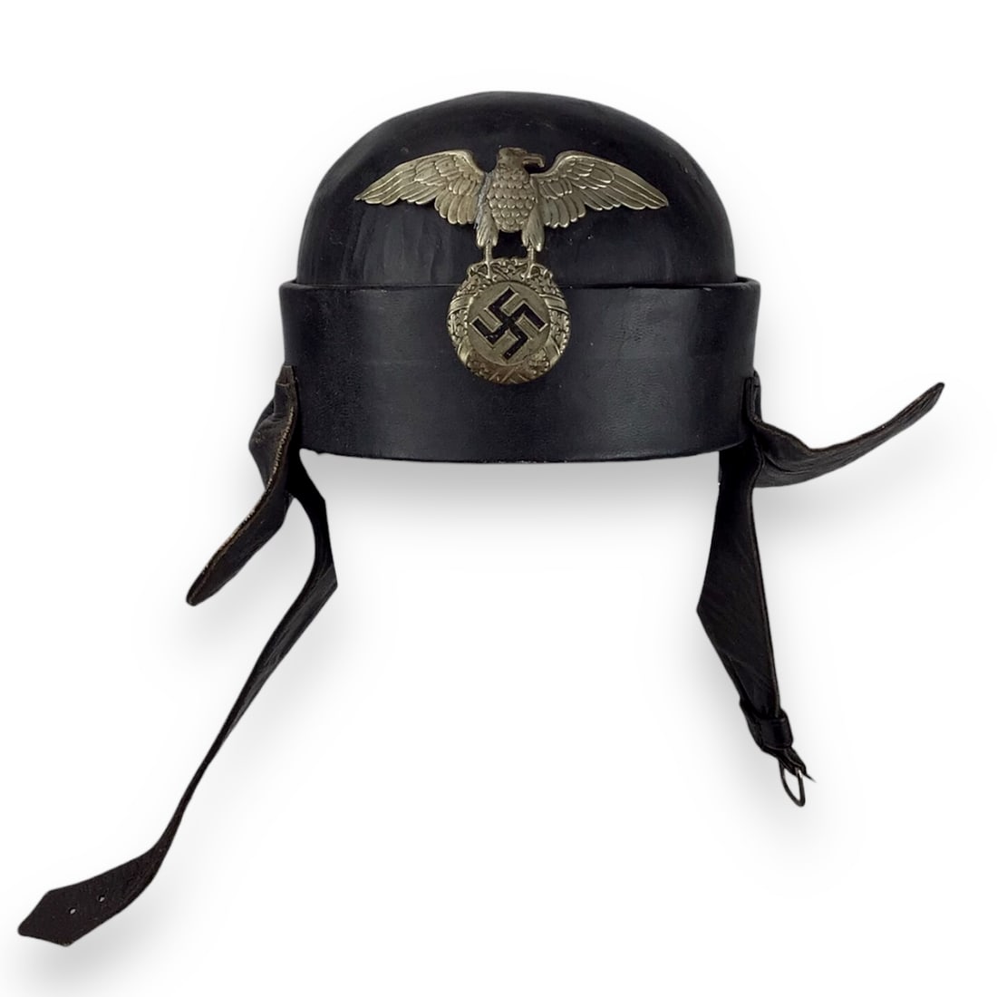 German WW2 NSKK German Motorcycle Crash Helmet Black Leather with Eagle Insignia 1st Pattern: A NSKK (National Socialist Motor Corps) 1st Pattern Crash Helmet, constructed of blackened, grained leather with stitched-on protective side and rear panels. The front center features an early pattern