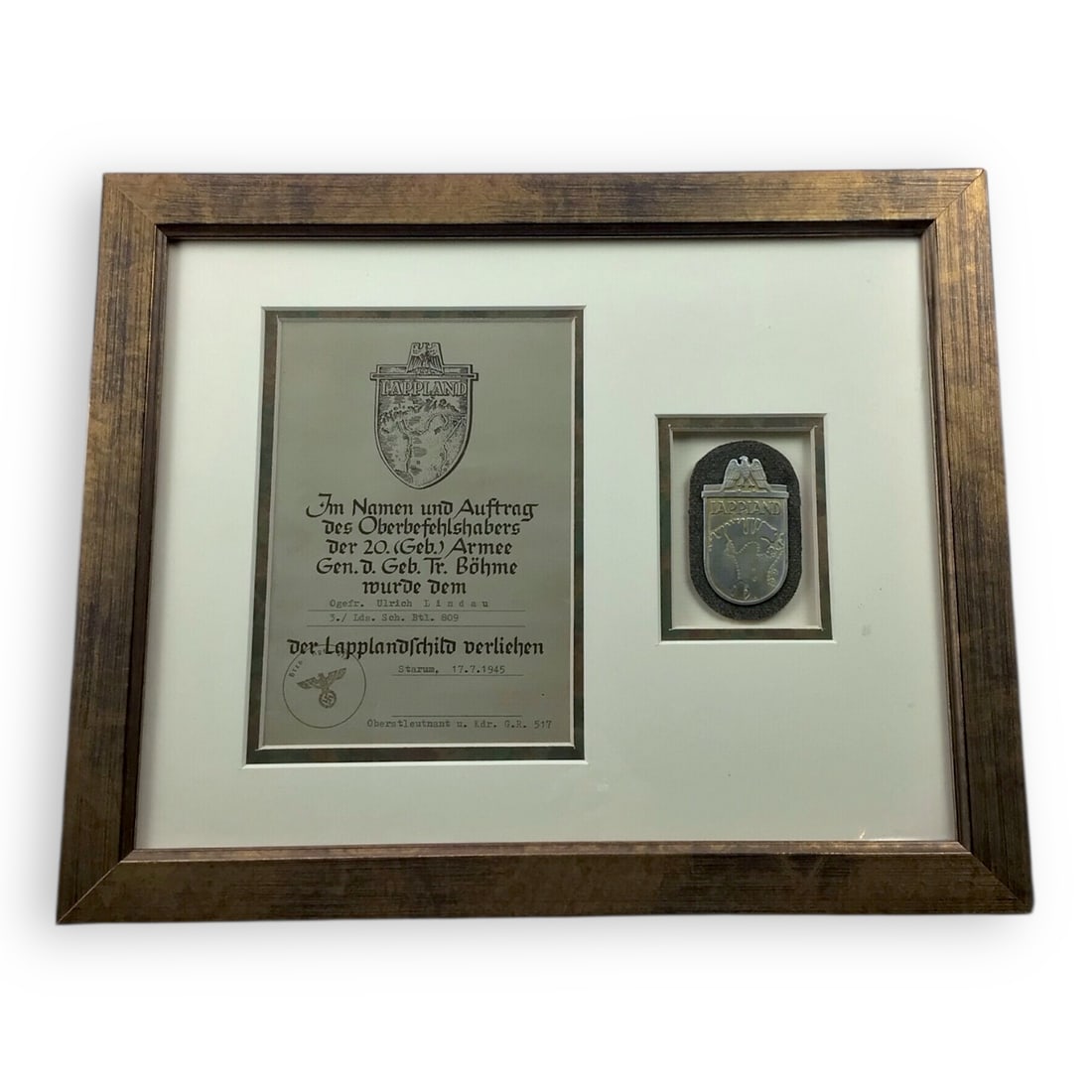 German WW2 Lappland Shield with Named Award Document - Framed Final Campaign Award: This original German World War II Lappland Shield is presented together with its matching named award document, both professionally framed and matted for display. The shield itself is a correct late-w