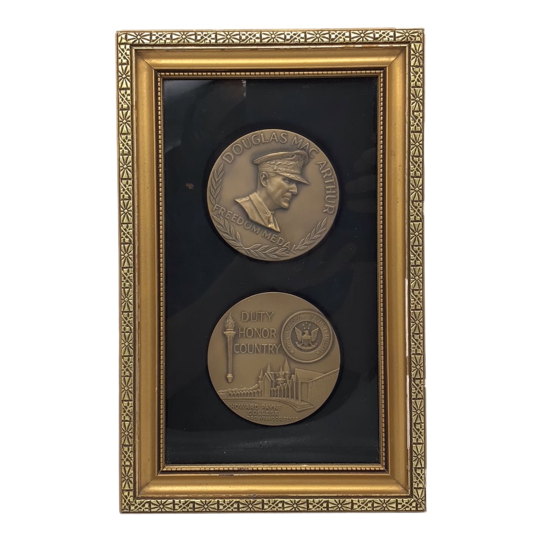 Douglas MacArthur Freedom Medal & Howard Payne Commemorative - Framed Display: This framed display features a Douglas MacArthur Freedom Medal paired with a "Duty "¢ Honor "¢ Country" commemorative medal associated with Howard Payne College, presented together in a decorative g