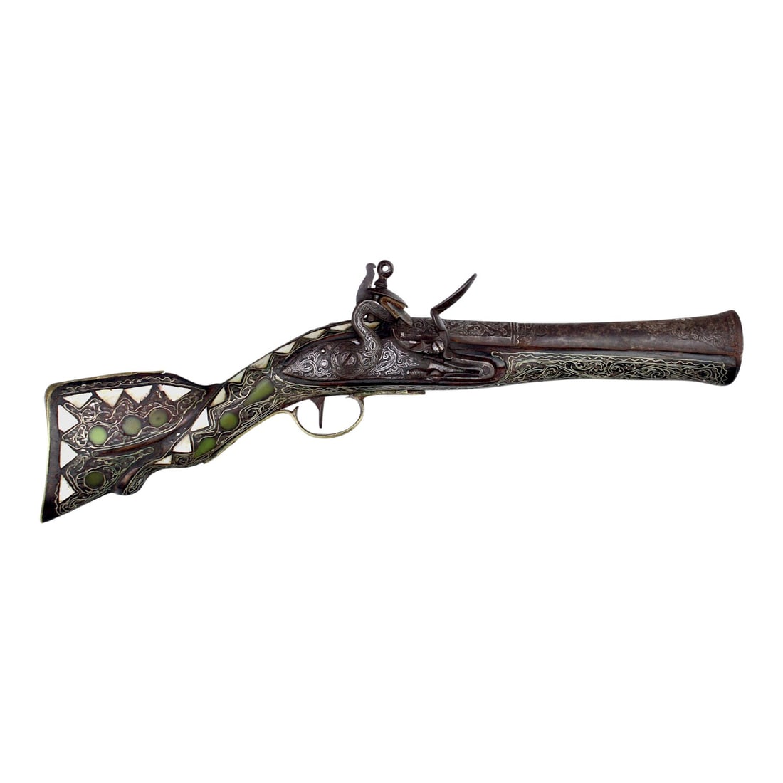 17th Century European Blunderbuss with Mother of Pearl and Green Inlays: This 17th-century European blunderbuss is an ornate early firearm decorated with mother of pearl and green ivory or jade-style inlays. The piece comes from a French American collector and museum curat