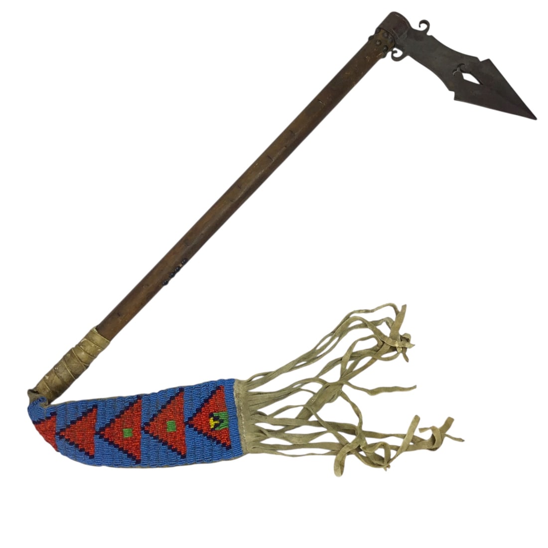 Large Native American Trade Tomahawk with Beaded and Leather Fringe Drop Indian War Period circa: This impressive Native American trade tomahawk, dating to the Indian War period circa 1880 to 1905, is distinguished by its large scale and the presence of an elaborate beaded and leather fringe drop.