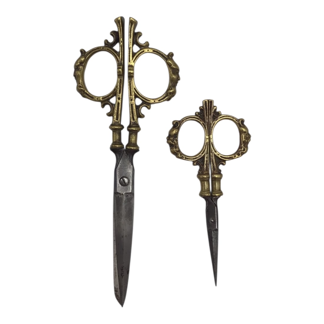 Antique Steel Scissors with Carved Brass Mounts, 7 Inches: This pair of antique steel scissors features attractive carved brass mounts and measures approximately 7 inches in overall length. The steel blades retain the functional form of a period cutting tool,