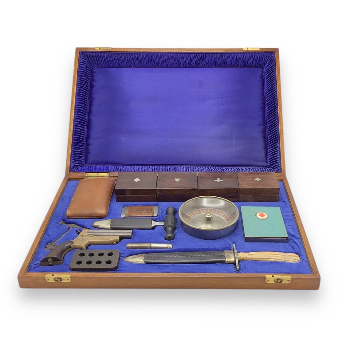 19th-Century Will & Finck Gambler's Kit with Derringer, Daggers, Cheating Devices, and Accessories: This exceptional 19th-century American Gambler's Kit is attributed to the legendary Will & Finck of San Francisco and includes an astonishing variety of period tools, weapons, and gambling par