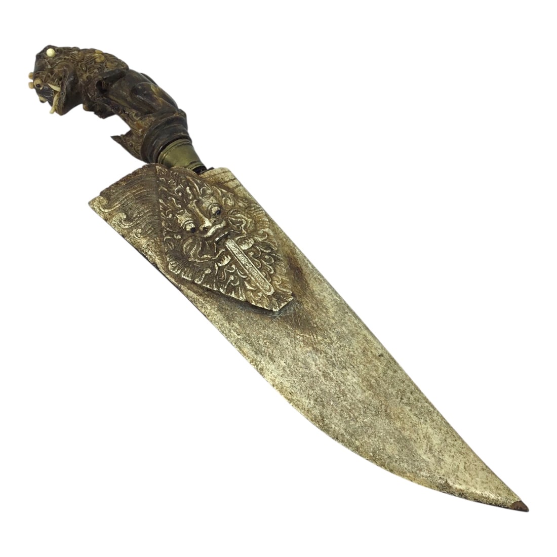 Unique Sri Lanka Ornate Demon Head Dagger with Green Man Sheath | 18th or 19th Century: This ornate Sri Lankan dagger, dating to the 18th or 19th century, features an elaborately carved hilt of exceptional craftsmanship. The hilt design is richly detailed and sculptural, presenting as a