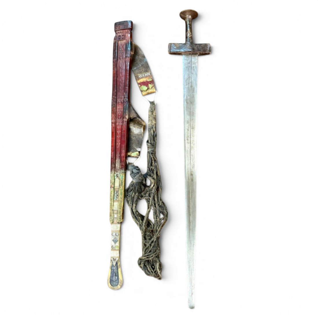 Late 19th C. Sudanese Kaskara Sword with Decorated Wooden Scabbard & Suspension Cords: This attractive traditional Sudanese Kaskara sword is a fine late 19th to early 20th century example retaining its original wooden scabbard with decorative panels, metal-mounted lower fittings, and su