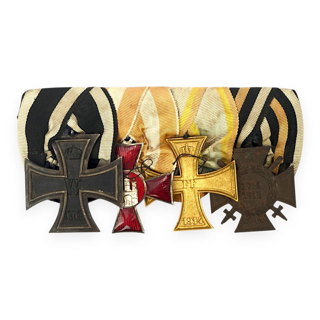 Imperial German WWI Four-Medal Dress Bar with Iron Cross & Hanseatic Cross: This Imperial German World War I four-medal dress bar is a strong parade and full-uniform mounted award group. The bar consists of a 1914 Iron Cross, a Hanseatenkreuz, a Mecklenburg-Schwer