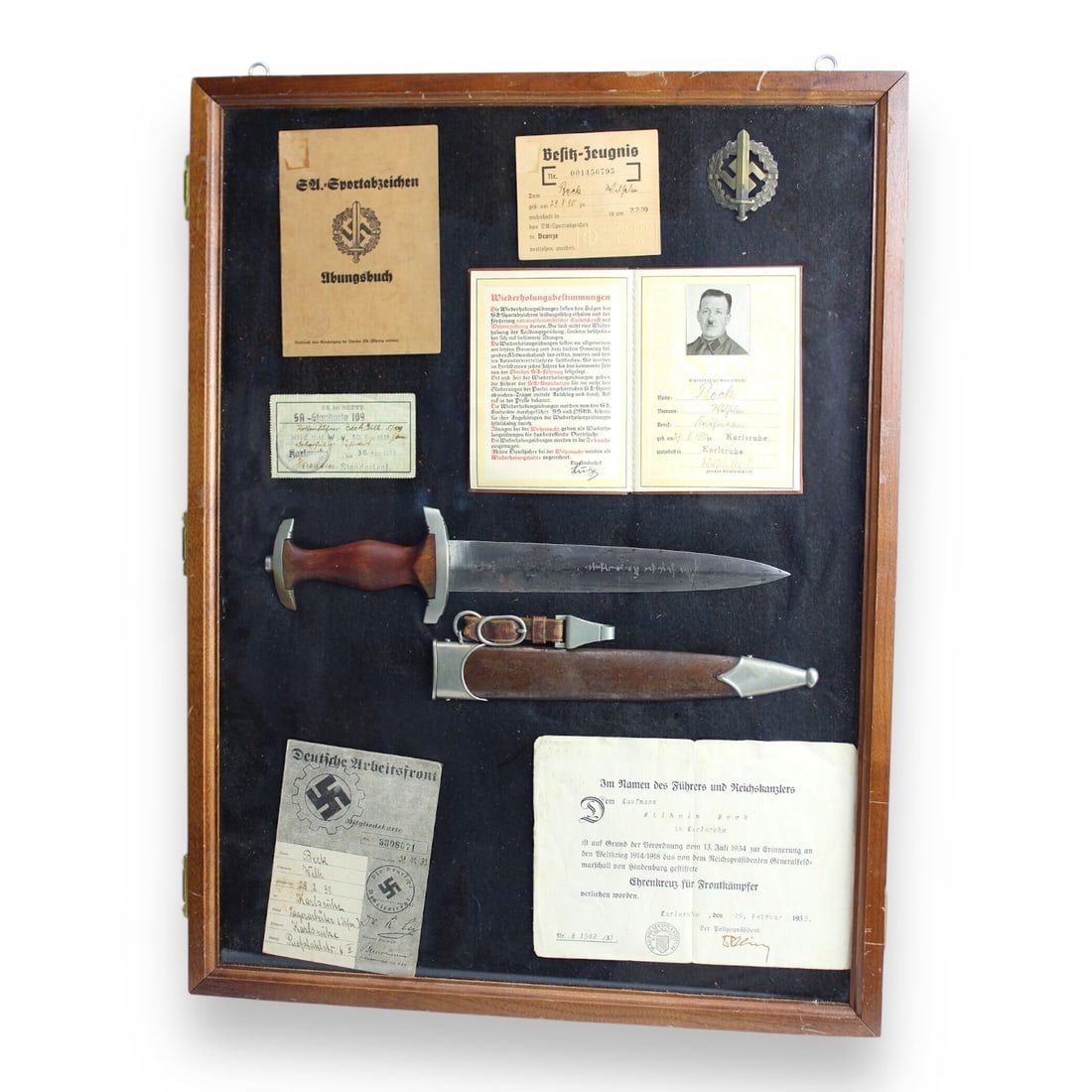 German Early WW2 War Grouping Rare GROUND ROHM SA Dagger + NAMED Docs & Badge to Wilhelm Beck: This exceptionally rare grouping showcases a collection of items from early WW2, centered around an SA Dagger featuring a grounded Röhm inscription on the reverse back. These presentation daggers wer