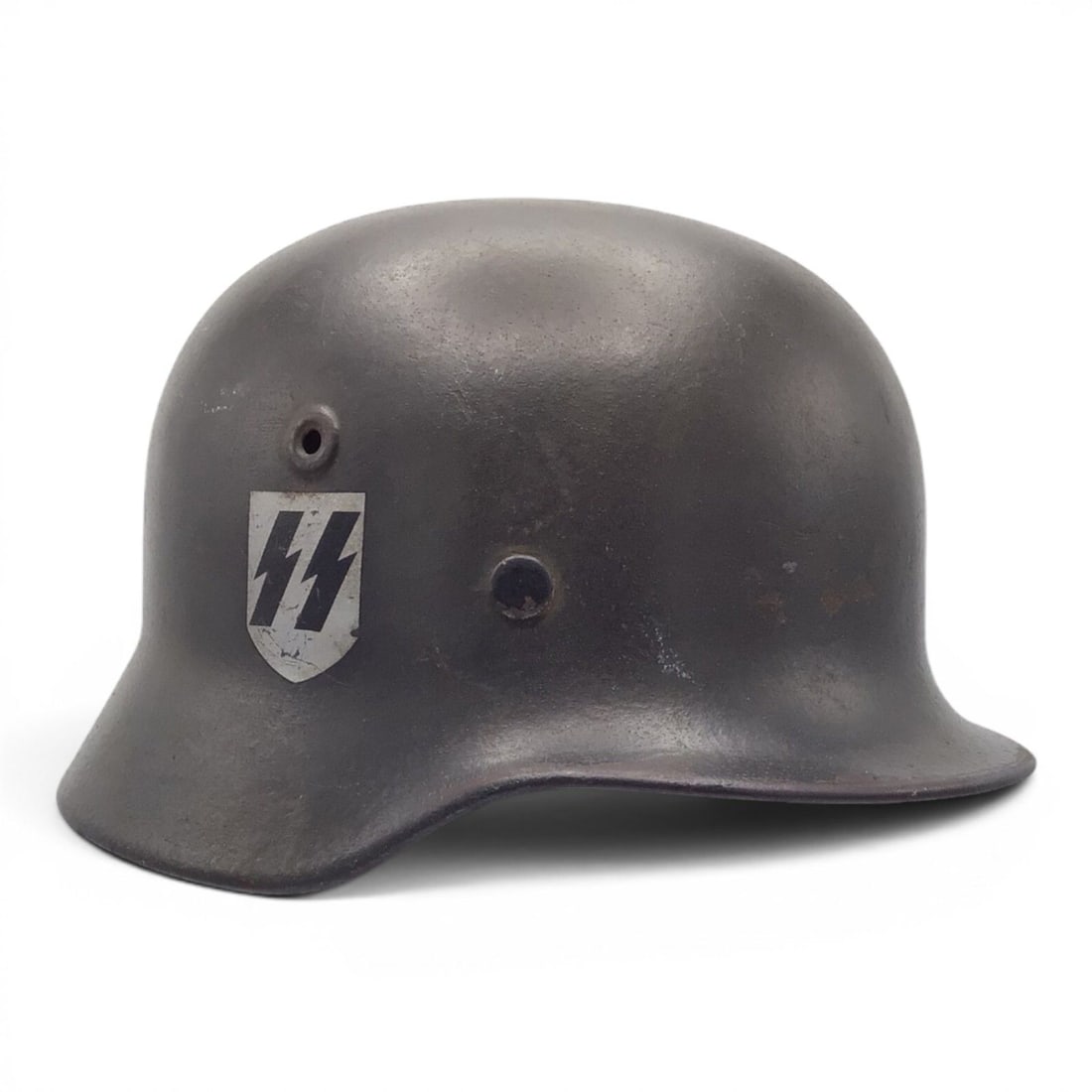 WWII German Waffen-SS M40 SD Helmet Quist Q64: This highly desirable WWII German M40 Single Decal Waffen-SS combat helmet was manufactured by Quist and is stamped Q64 on the interior skirt, indicating the sought-after large size 64 shell. The
