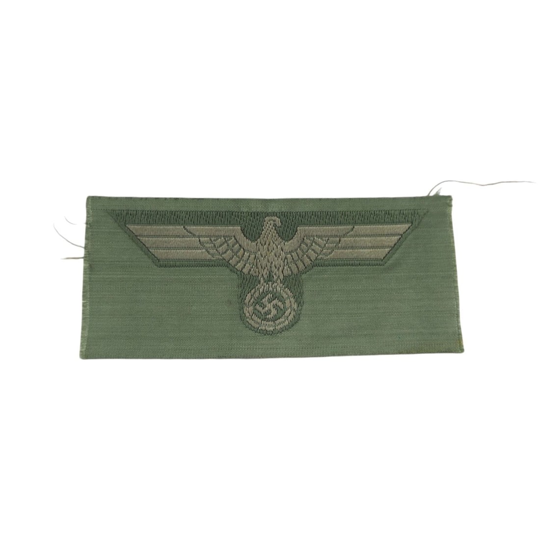 German WW2 M40 Army Heer "BeVo" Cap Eagle MINT Condition: This German WWII M40 Army Heer BeVo cap eagle is a mint condition example of the woven cap insignia worn by German Army personnel. Produced in the BeVo machine-woven style, the eagle retains crisp det