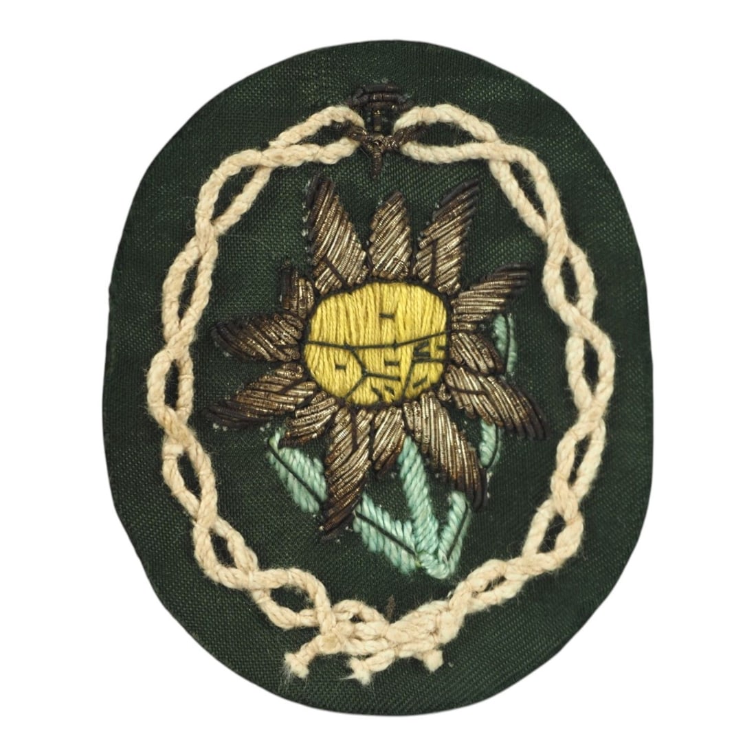 German WW2 Gebirgsjäger Officer Edelweiss Sleeve Insignia, Silver Bullion Vet Bring-Back: This rare German WWII Army Heer Gebirgsjäger Mountain Troops officer Edelweiss sleeve insignia is a uniform-removed veteran bring-back example featuring desirable silver bullion construction. The Ede