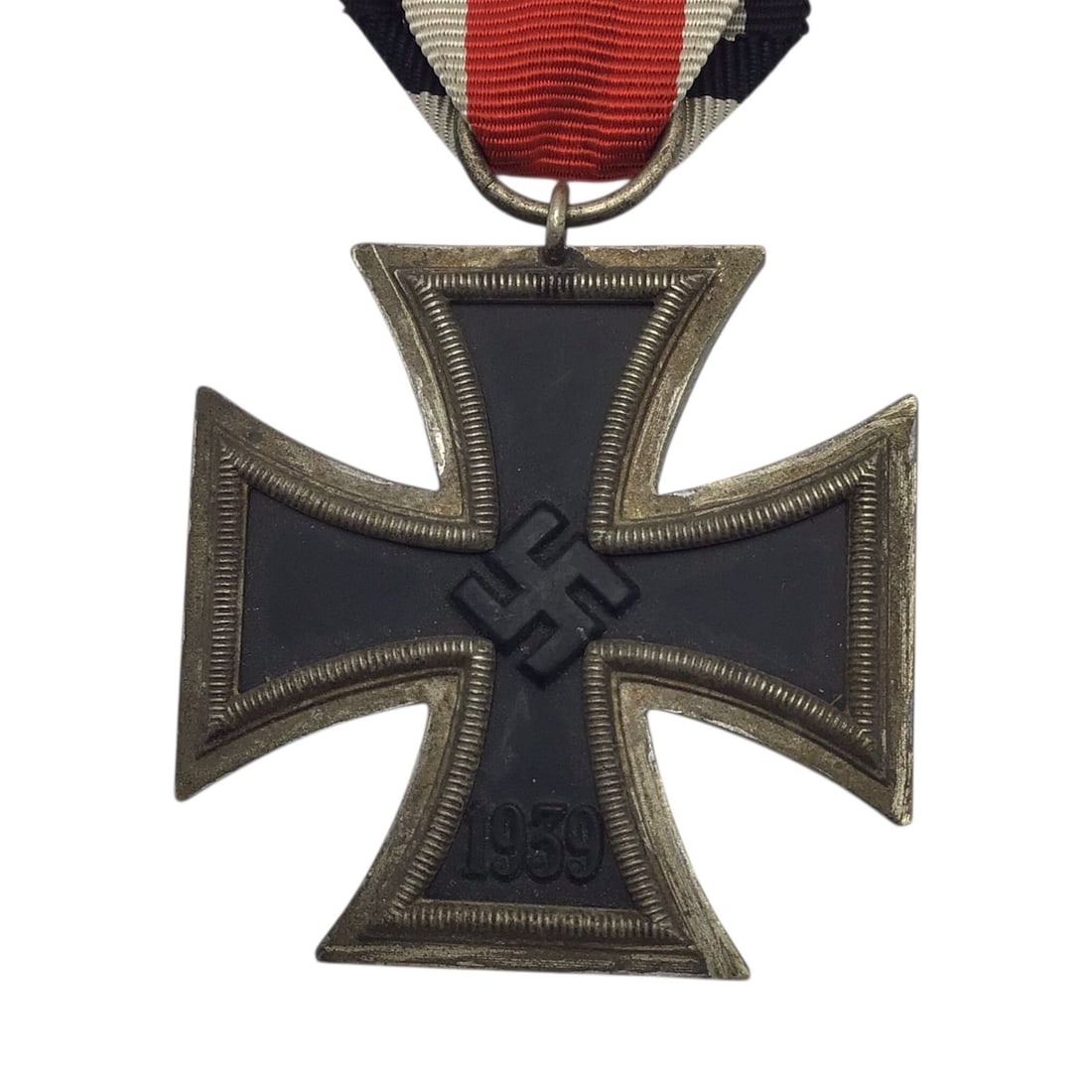 German WWII 1939 Iron Cross 2nd Class with Ribbon & Miniature Iron Cross Device: This original German World War II 1939 Iron Cross 2nd Class is a highly attractive and honest example of one of the most iconic military decorations of the twentieth century. The cross retains its cri