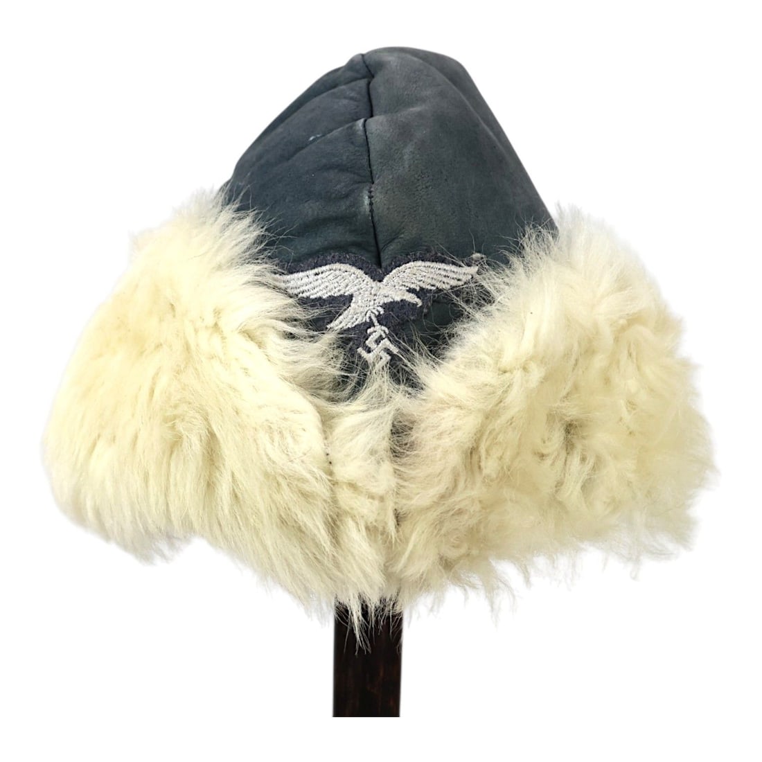 German WWII Luftwaffe Leather Winter Field Cap, Eastern Front Type: This German World War II Luftwaffe leather winter field cap is a cold-weather headgear example likely associated with Eastern Front use. The cap is constructed in the leather winter pattern and shows 