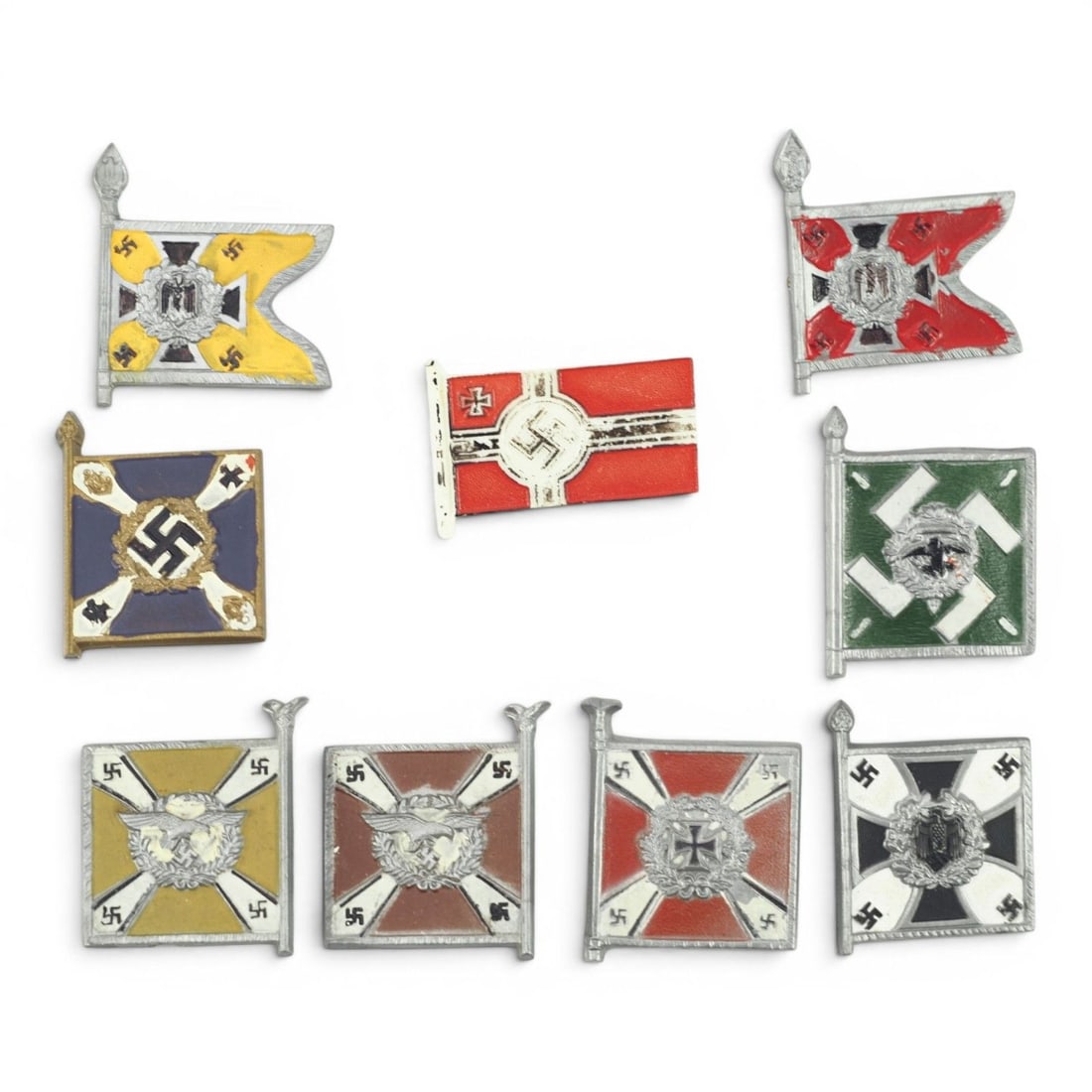 Set of 9 German WW2 WHW (Winterhilfswerk) Donation Tinnies: This attractive set of nine German World War II WHW (Winterhilfswerk des Deutschen Volkes) donation tinnies represents an excellent cross-section of the miniature fundraising badges issued throughout 