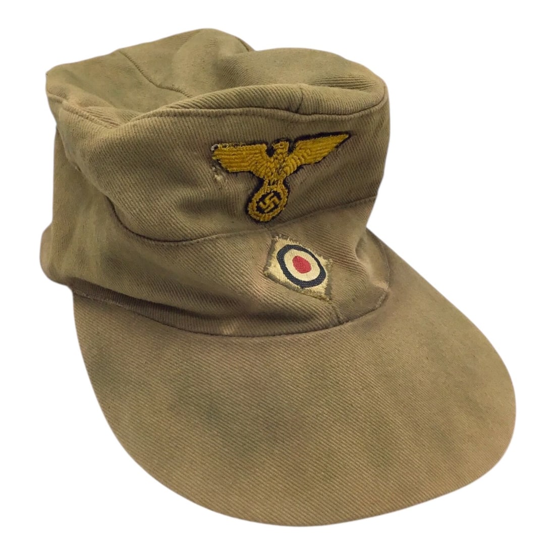 Rare German WW2 Kriegsmarine M41 Tropical Afrika Korps Cap: This rare German WWII Kriegsmarine M41 tropical cap is an original tan-colored example featuring a distinctive pink interior lining. Of particular note, the applied front eagle insignia is the less co