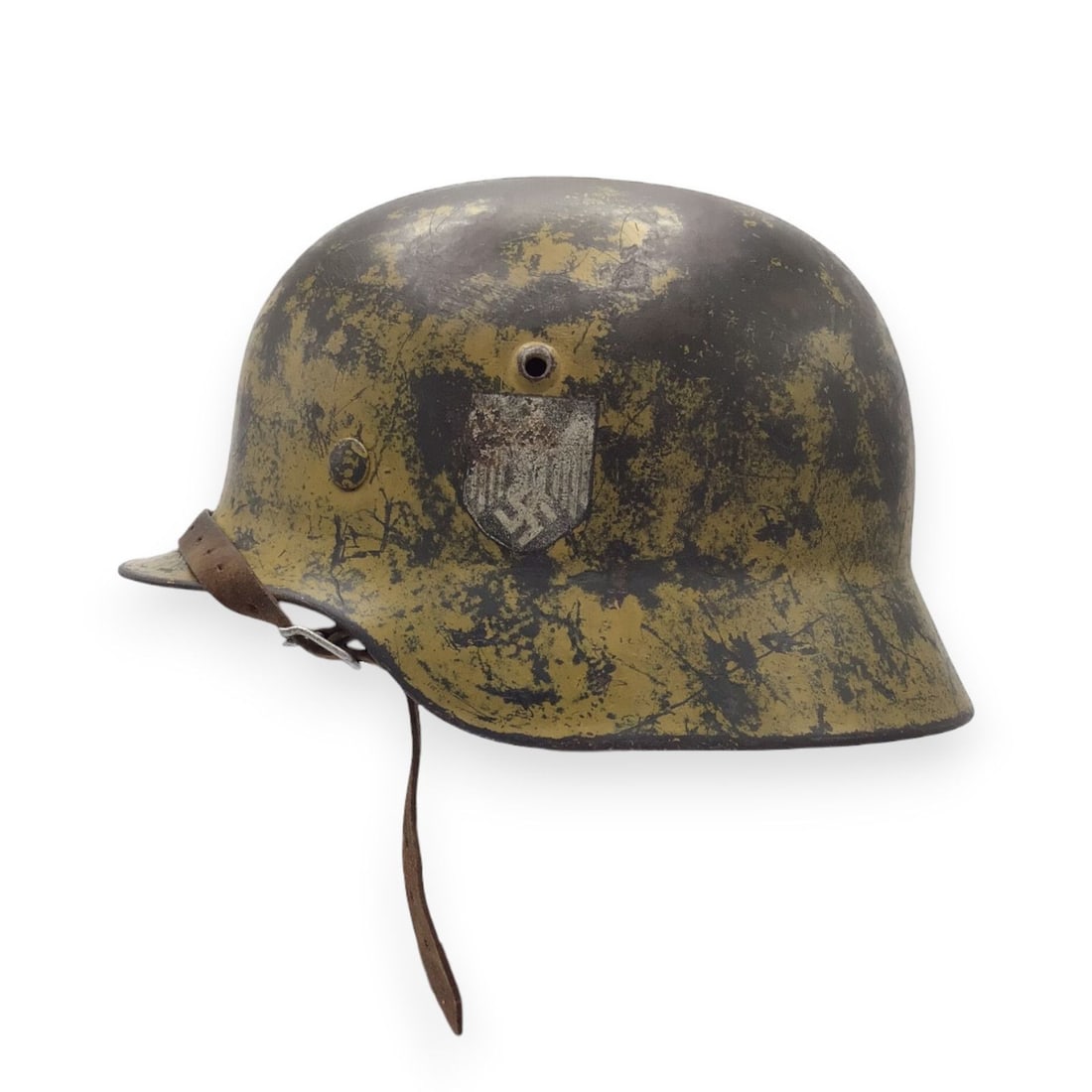 WWII German Heer M40 Afrika Korps Camouflage Helmet - DAK Rarity: This fine original WWII German Heer M40 combat helmet was produced by Eisenhüttenwerke Thale and is stamped ET64 with lot number 1221. The helmet retains a thick field-applied tro