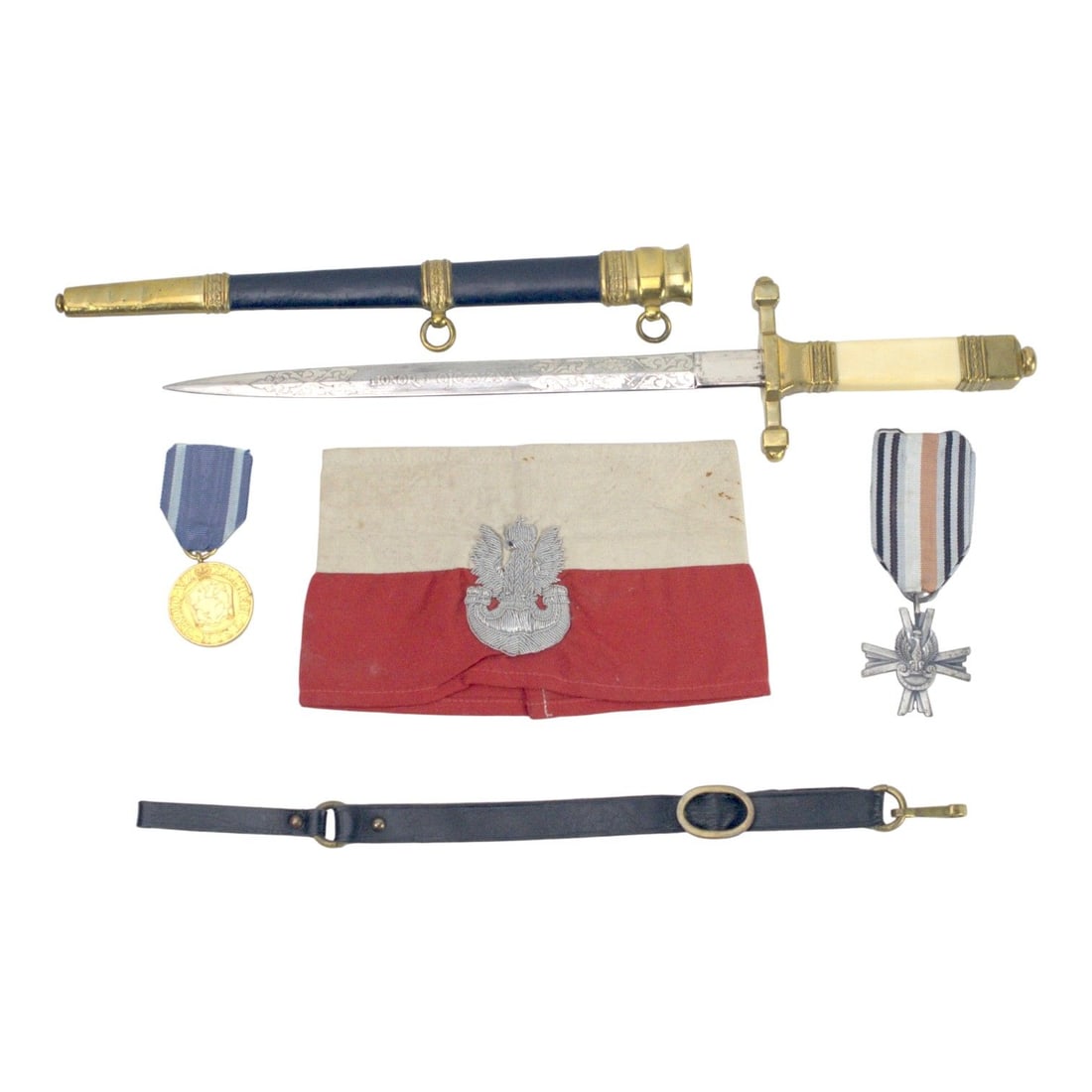 Outstanding Polish WWII Freedom Fighter Grouping with Warsaw Armband, Medals & Officer Daggers: This extraordinary Polish World War II Freedom Fighter grouping is an exceptional collection of Polish military history, beautifully presented across two Riker display cases. The grouping includes a r