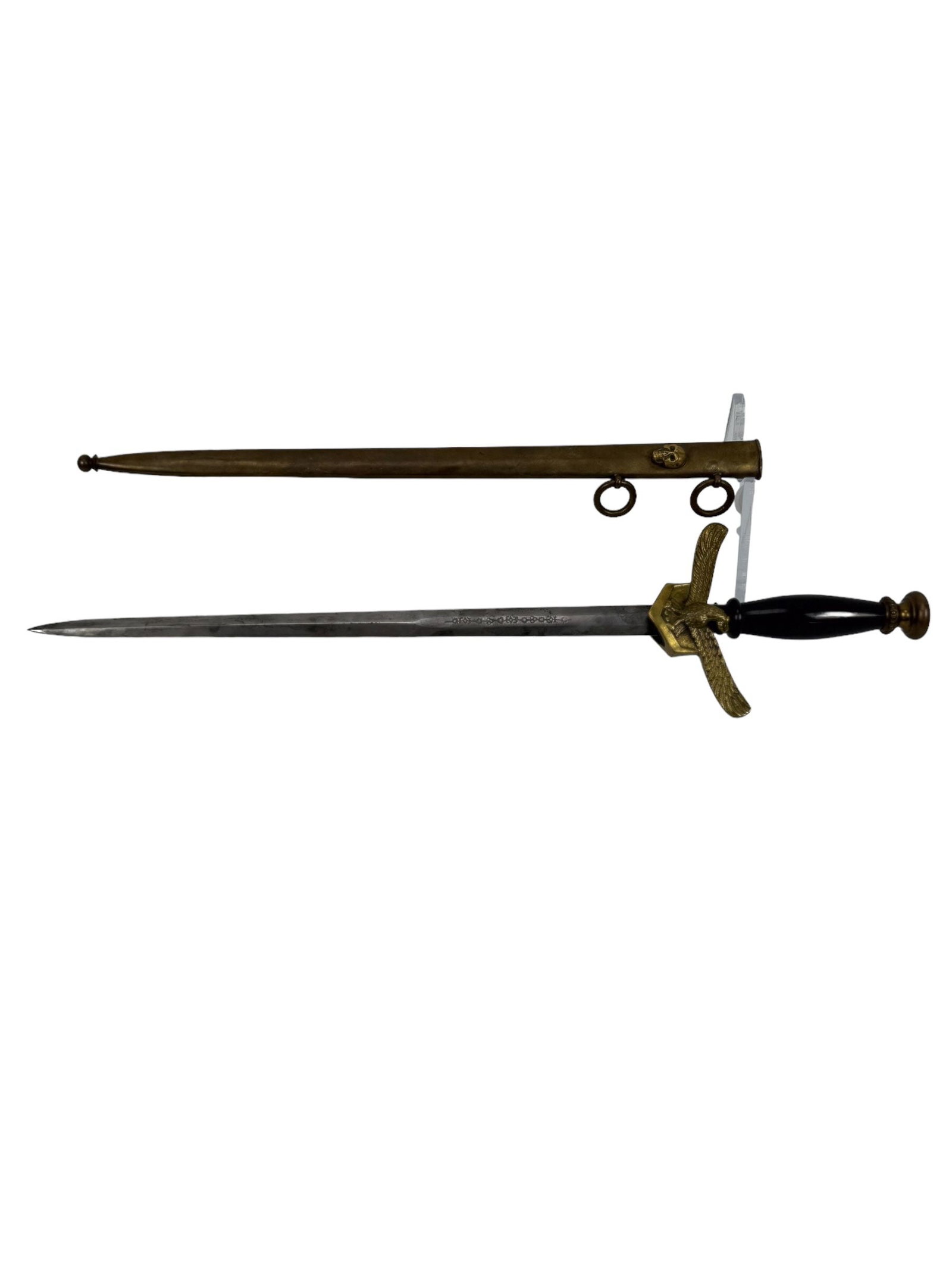 Skull 1965 South African Air Force Officer's Dagger with Skull-Motif Scabbard: This impressive 1965 South African Air Force officer's dagger features a sleek black handle and a finely detailed hilt adorned with sharply rendered eagle and national emblems. The blade is well prese