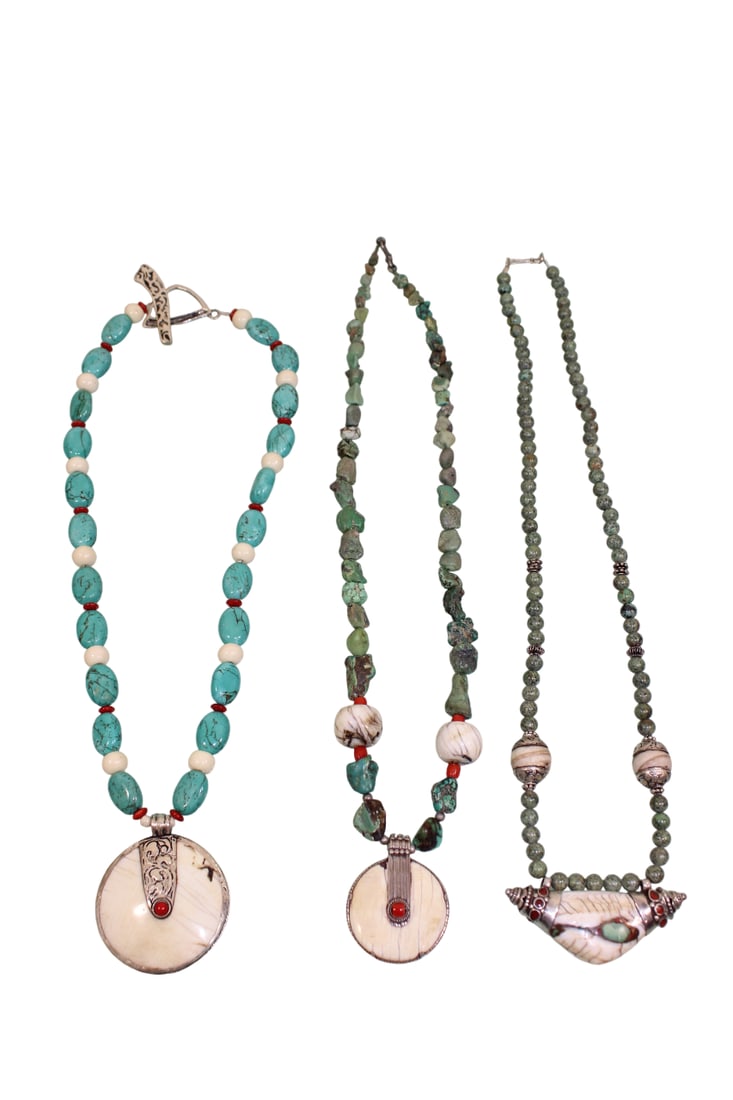 3 Necklaces with Nepalese Shell Pendants with Silver Fittings: Longest necklace is 22" Long. Includes matching earrings.