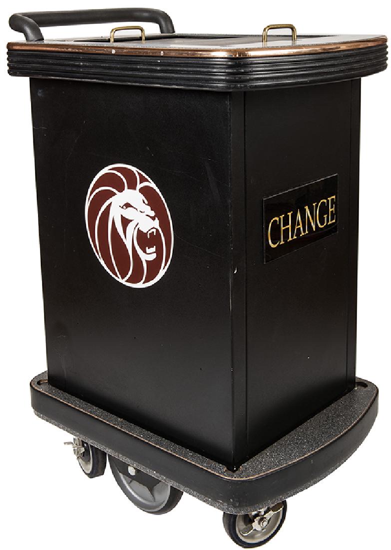 MGM Grand Casino Change Cart.: MGM Grand Casino Change Cart. Circa 1990. Rolling cart used to hold change and used in casino operations. MGM Grand lion logo, six heavy rolling wheels. With change trays and sleeves inside. 36 1/2" h