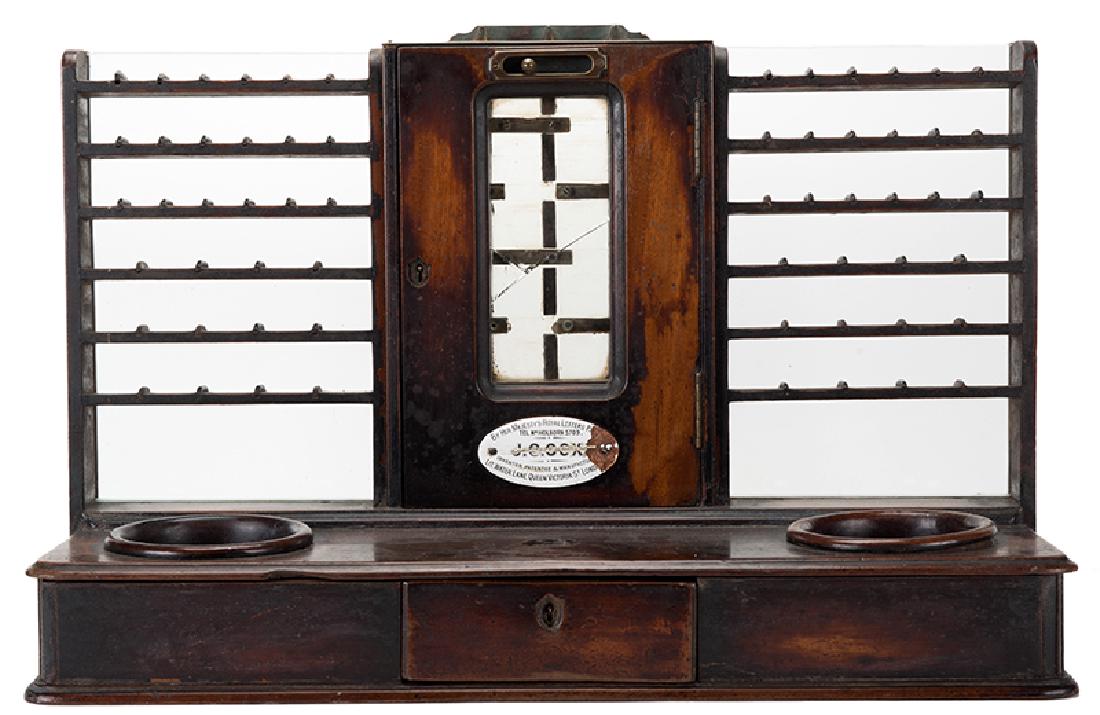 J.C. Cox English Gold Changer & Till.: J.C. Cox English Gold Changer & Till. London, ca. 1895. Coins are inserted into slots in the top of the center section of the till, and movement of the lever from side to side causes the coins to make