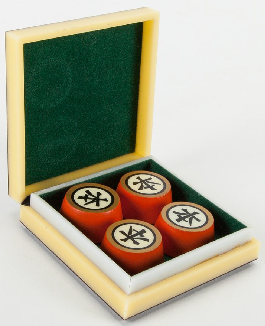 Chinka Chink.: Chinka Chink. Holland: Eddy Taytelbaum, 1970s. Four turned wooden blocks with reverse-painted Japanese characters magically transpose positions. In polished brown and yellow plastic case, with Japanes