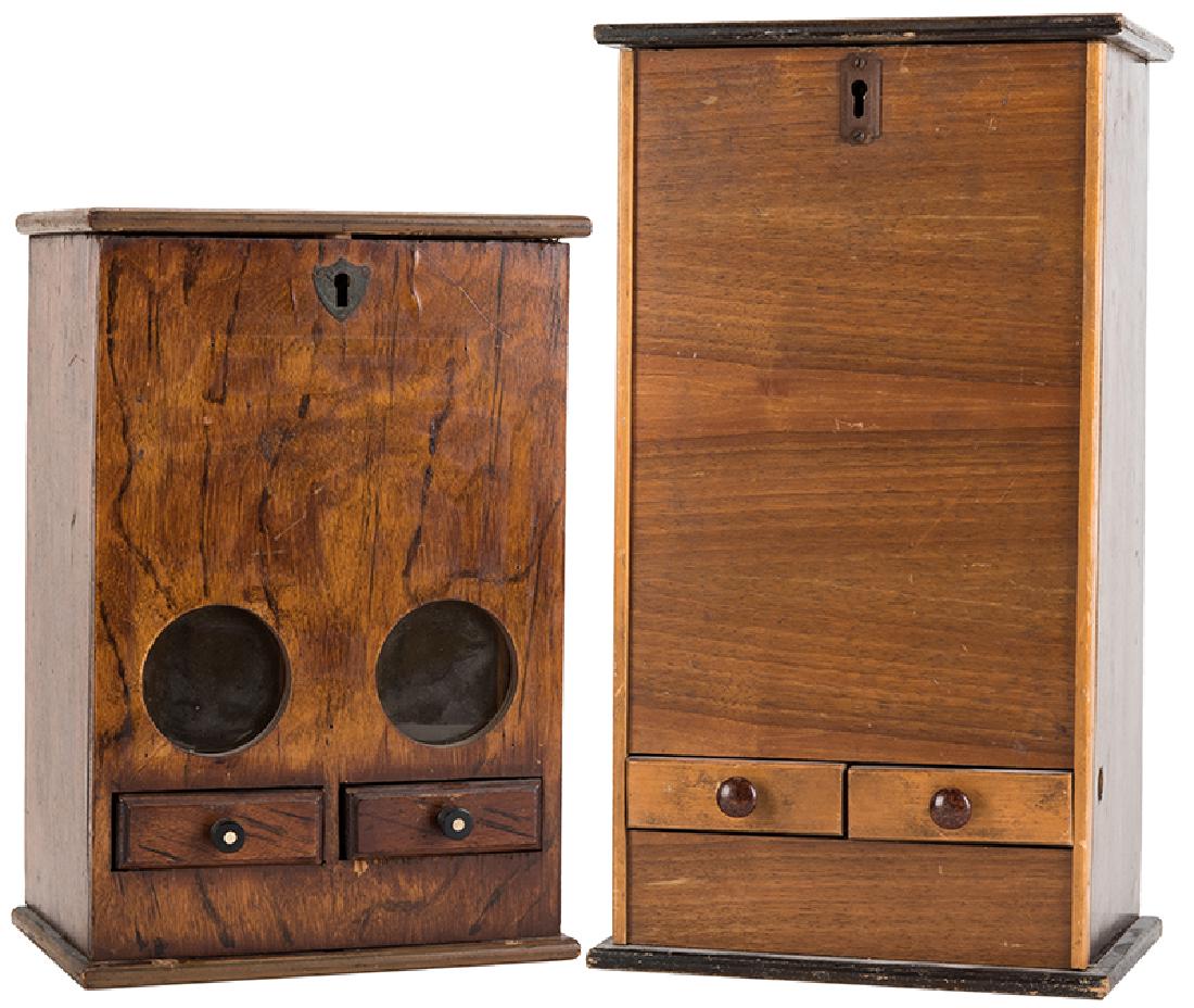 Two Mystery Vending Machines.: Two Mystery Vending Machines. American, early twentieth century. Both these vending machines appear to have been manufactured by the same company. All wood except for the two coin slots on top of each