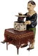 Antique Wind-Up Magician Toy.