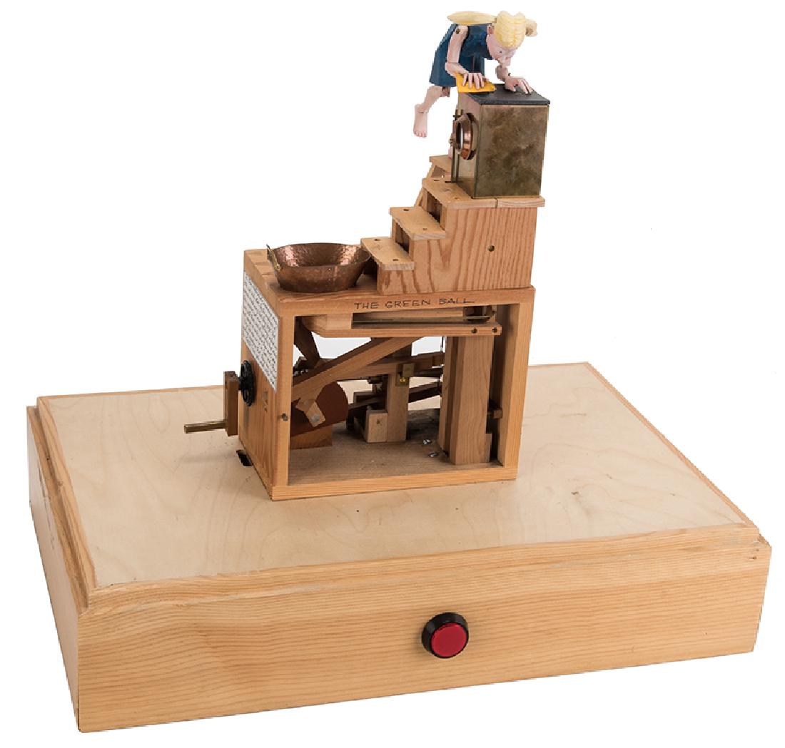 The Green Ball Machine Automaton.: The Green Ball Machine Automaton. Stithians, Cornwall: Paul Spooner (designer) and Matt Smith (builder), 1993. Depicting a washing girl who rubs vigorously to the top of a washing machine until a ball