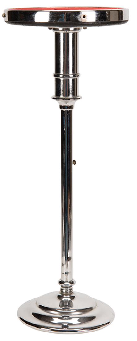 Handkerchief Pedestal.: Handkerchief Pedestal. Circa 1920. Chrome plated stand secretly introduces a handkerchief into a glass tumbler resting on top of it. 13" high. Mechanism noisy.