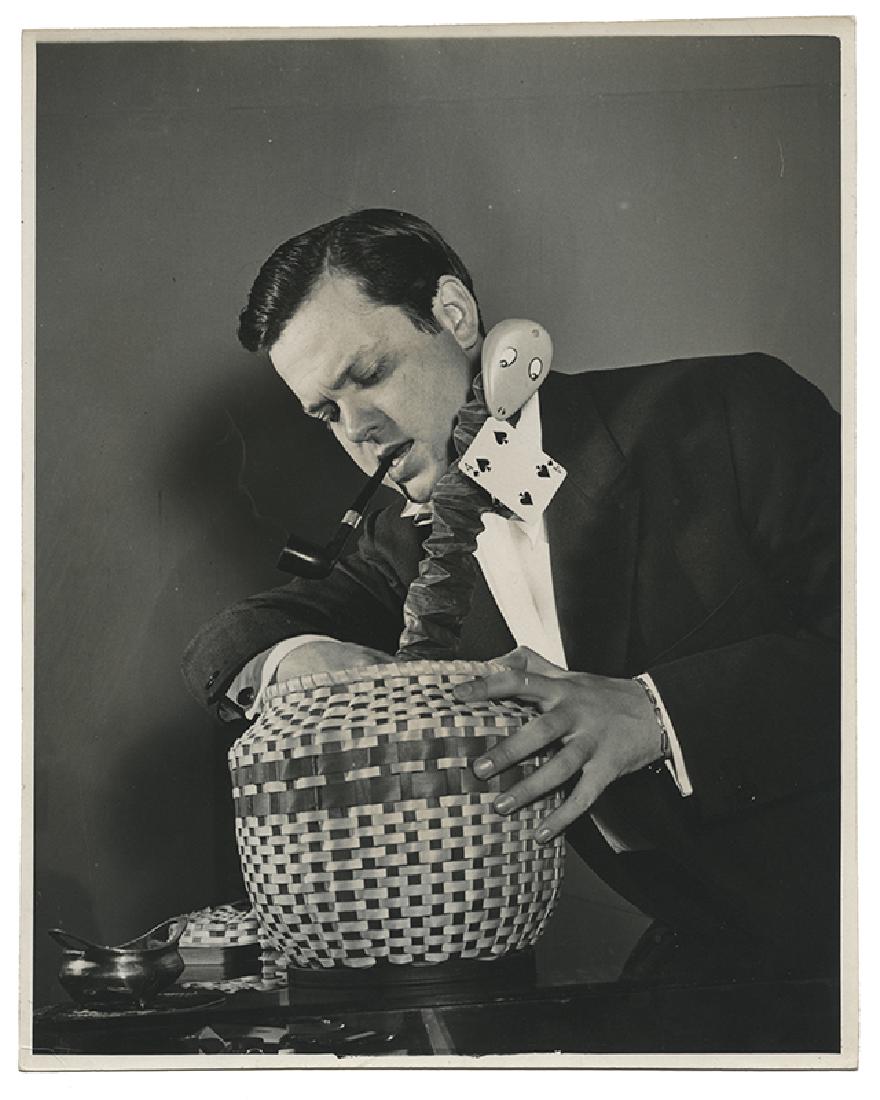 Two Photographs of Orson Welles with Magic Props.: Welles, Orson. Two Photographs of Orson Welles with Magic Props. New York: W. Eugene Smith, for Life Magazine, ca. 1940s. Matte-finish silver prints, depicting Welles in Stuart Robson's magic shop in