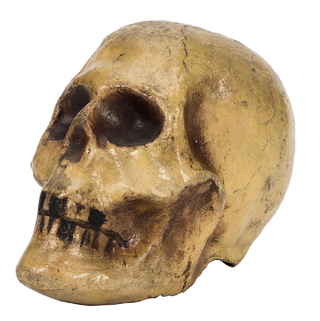 Vintage Magic Production Prop Skull.: Vintage Magic Production Prop Skull. American [?], mid-twentieth century. Rigid papier-mache skull, glazed, with painted teeth and cavities. 5 x 4 x 6”. Fine.