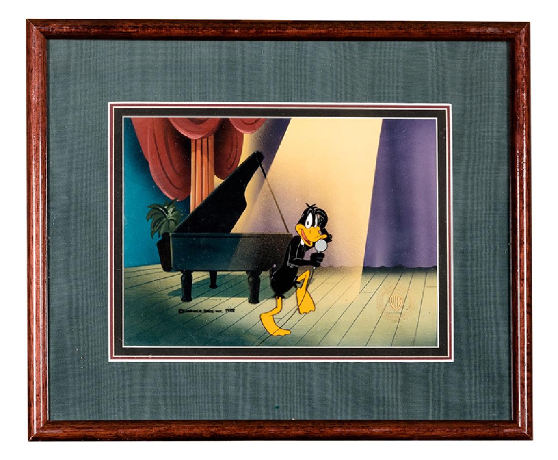 Donald Duck Limited Edition Animation Cel.: Donald Duck Limited Edition Animation Cel. Warner Bros., 1988. Limited edition colored cel, depicting Donald Duck in the limelight onstage with microphone and piano. Lacquered wooden frame, 15 ½ x 20