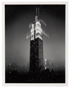 Two Photographs of Iconic New York Skyscrapers.: [New York City] Two Photographs of Iconic New York Skyscrapers. Circa mid-1990s. Gelatin silver print by photopaper by Len Prince depicts The Empire State Building on a foggy night (14 x 11”); a