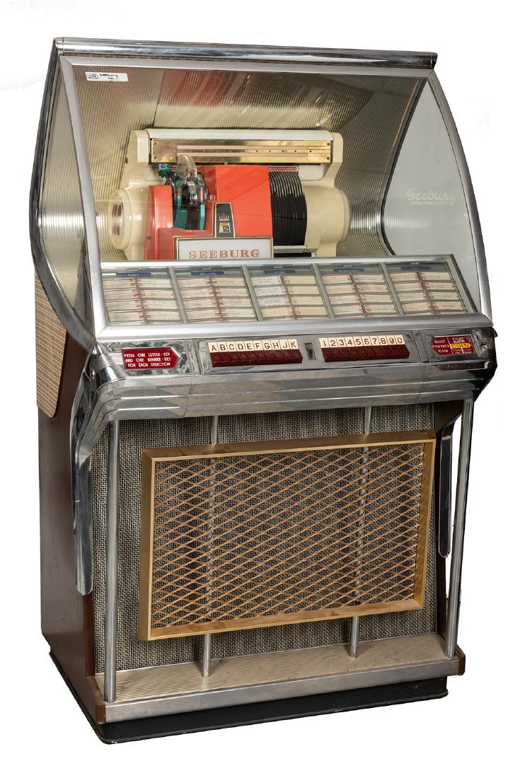 Seeburg 1955 Model 100J Jukebox (5/10/25 Cents).: Seeburg 1955 Model 100J Jukebox (5/10/25 Cents). Chicago, 1955. One hundred 45 RPM record selections. Lock and key. 59 x 35”.