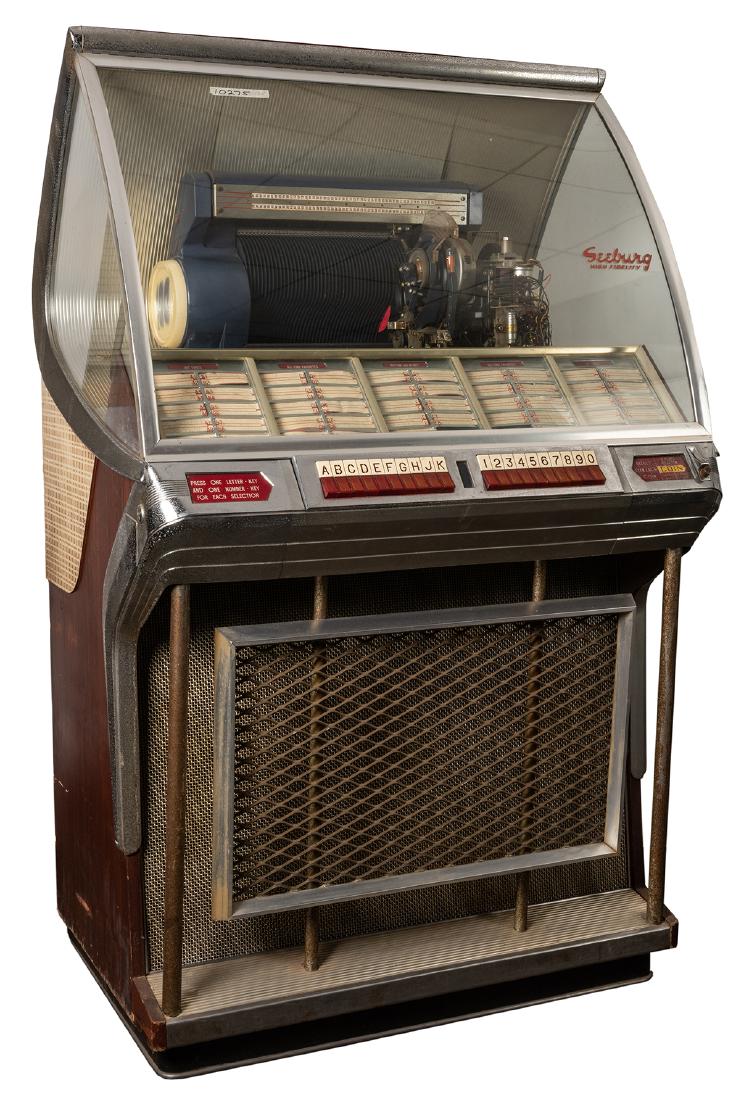 Seeburg 1955 Model 100J Jukebox.: Seeburg 1955 Model 100J Jukebox. Chicago, 1955. One hundred 45 RPM record selections. One play for a nickel, two plays for a dime and six plays for a quarter. Lock, no key. 59 x 35”. Metal pitte