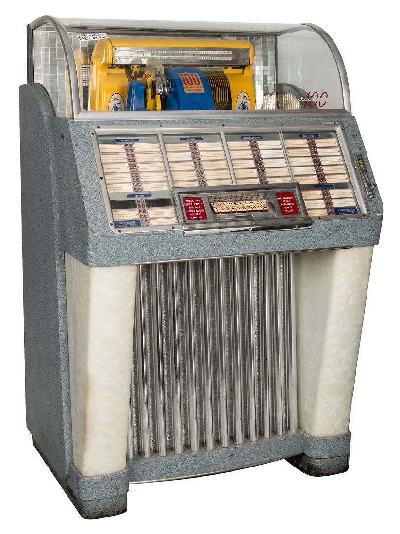Seeburg 1952 Model M100C Jukebox (25 Cent).: Seeburg 1952 Model M100C Jukebox (25 Cent). Chicago, 1952. One hundred selections 45 RPM records. No lock or key. 54 x 35”. Plastics not cracked.