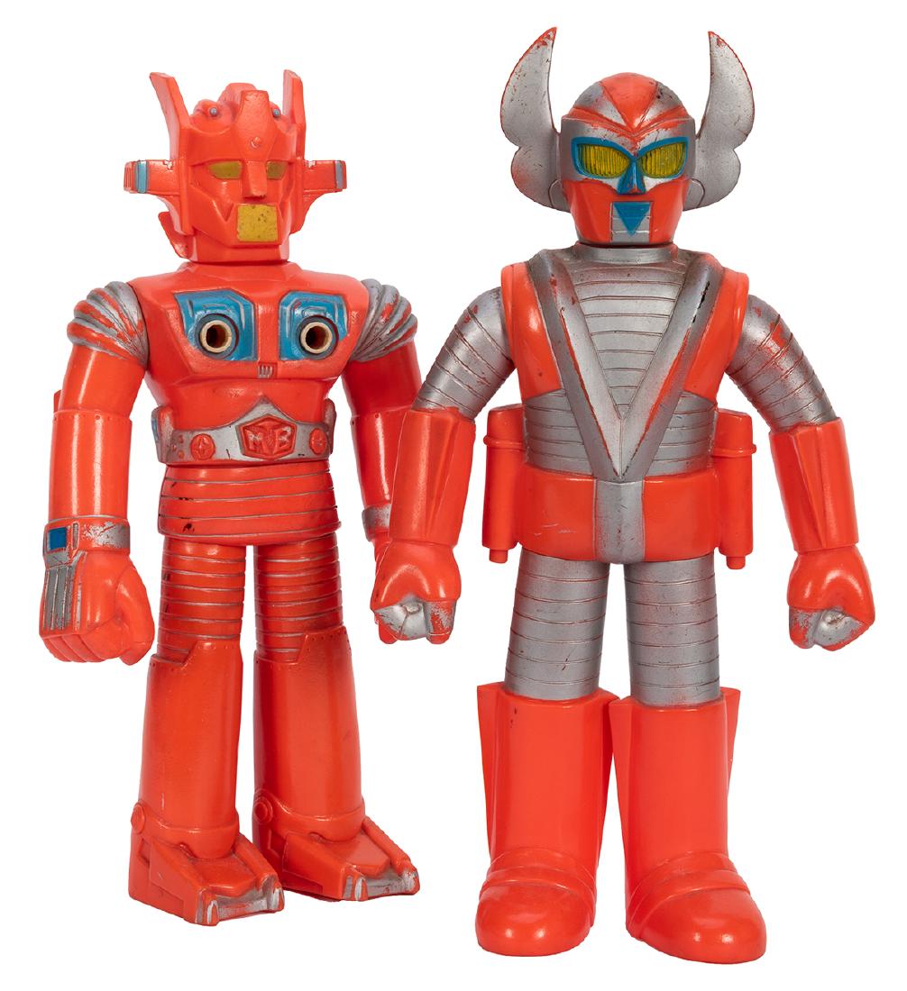 Pair of 1970s Bandai Vinyl Robots.: Pair of 1970s Bandai Vinyl Robots. Circa 1970s. Vinyl robot figures marked “Japan” to underside with Japanese lettering, the Mach Baron figure stamped with the Bandai logo. Height 10 ½