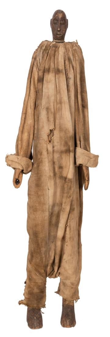 Tall African Wood Carved Dressed Doll/Puppet.: Tall African Wood Carved Dressed Doll/Puppet. Nigeria, twentieth century. Impressive all wood ceremonial Yoruba doll, dressed in heavily soiled and aged burlap fabric. Head carved in detail with triba