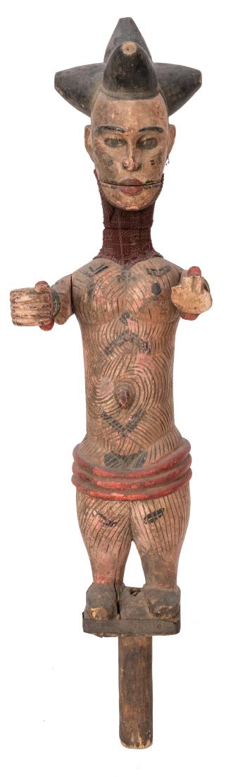 Ibibio Puppet: Ibibio Puppet. Nigeria, first half twentieth century. Articulated jaw, moveable arms and flexible fabric covered neck on this ornately carved and painted vintage puppet. Height 38". Faults consistent 