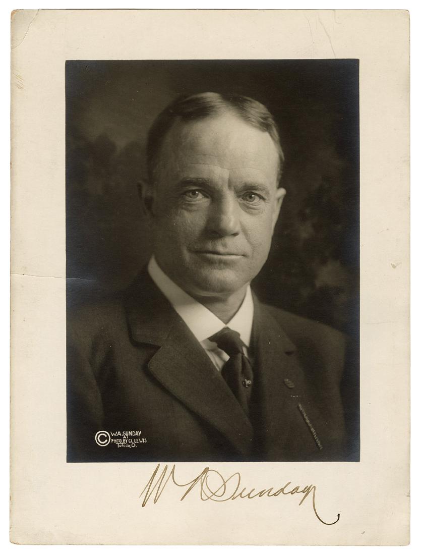 Signed Photograph of Billy Sunday.: Signed Photograph of Billy Sunday. Toledo: C.L. Lewis, ca. 1914. Silver print portrait photograph of Sunday, who won two National League pennants in the 1880s with the Chicago White Stockings, and bec