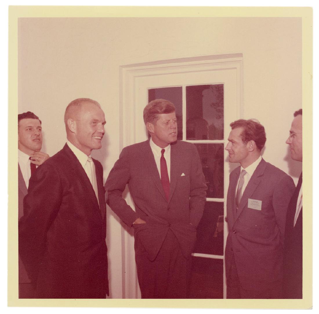 Original Photograph of JFK, John Glenn, and Gherman: Kennedy, John F. Original Photograph of JFK, John Glenn, and Gherman Titov. 1962. Glossy photograph (5 x 5”) by official White House photographer Cecil Stoughton. From Stoughton’s own file, on wat