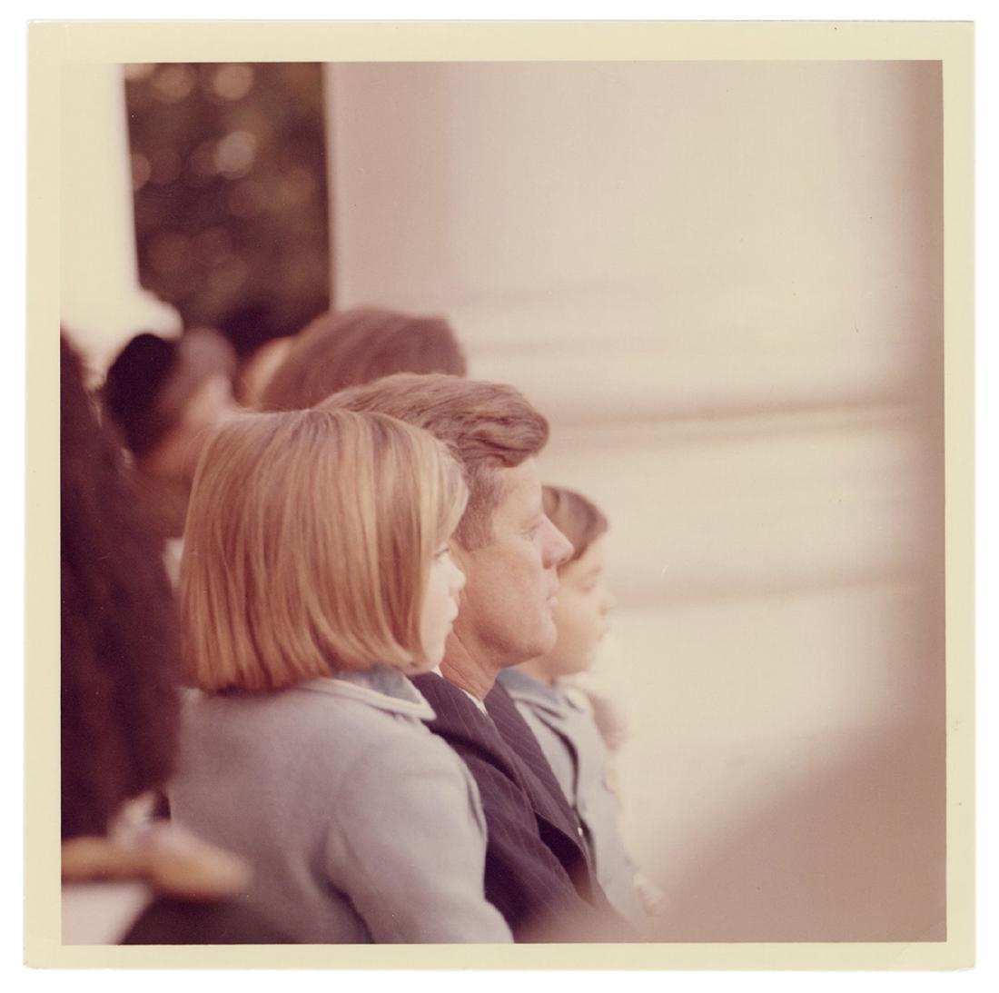 Original Photograph of JFK and Family.: Kennedy, John F. Original Photograph of JFK and Family. 1963. Glossy photograph (5 x 5”) by official White House photographer Cecil Stoughton, showing Kennedy with his children Caroline and John Jr.